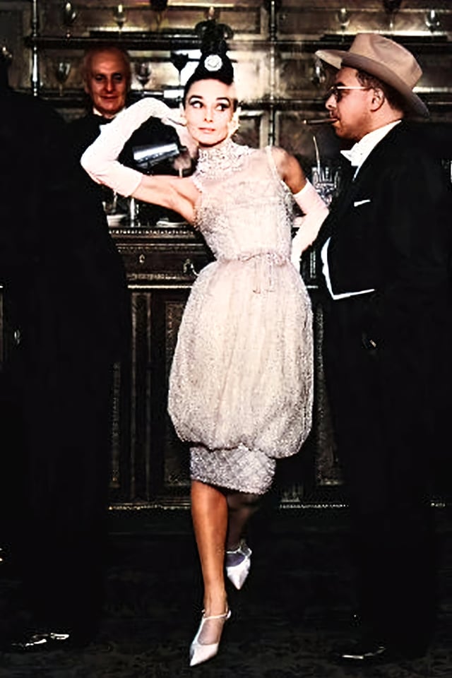 Audrey Hepburn wearing a Christian Dior dress (designed by Yves Saint Laurent)at Maxim's, photographed by Richard Avedon for Harper's Bazaar September 1959 : r/whatthefrockk
